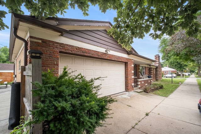 view of side of property with a garage