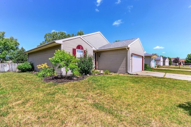 ranch-style house with a garage and a front yard