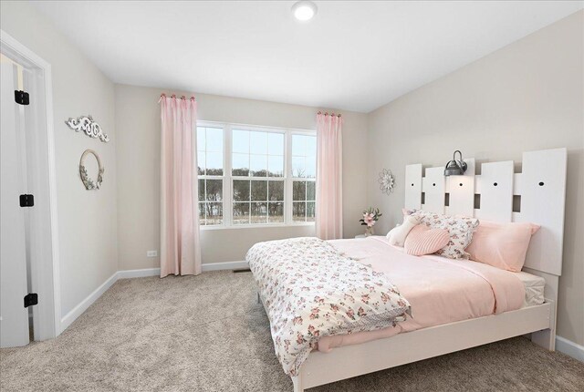 bedroom with light colored carpet