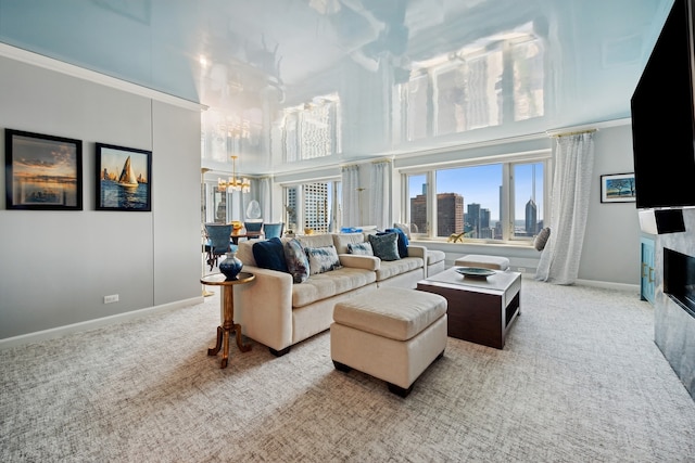 carpeted living room featuring an inviting chandelier