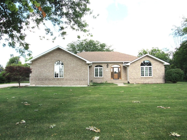 single story home featuring a front yard