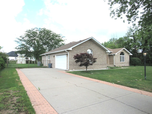 ranch-style home with a garage and a front lawn