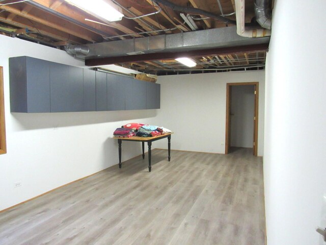 basement featuring light hardwood / wood-style floors