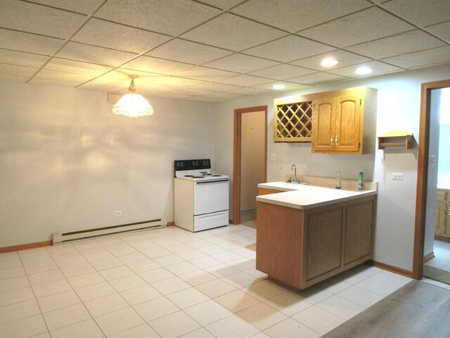 kitchen featuring a drop ceiling, light tile patterned floors, white electric range, baseboard heating, and sink