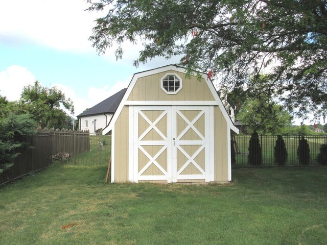 view of outbuilding with a yard