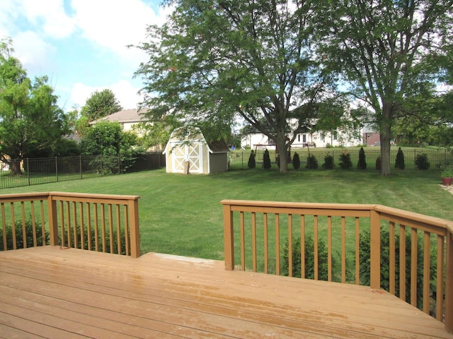 deck with a yard and a storage unit