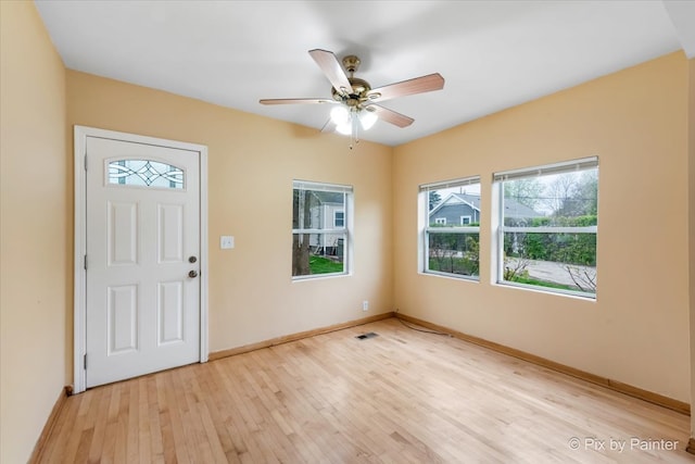 entryway with ceiling fan and light wood-type flooring