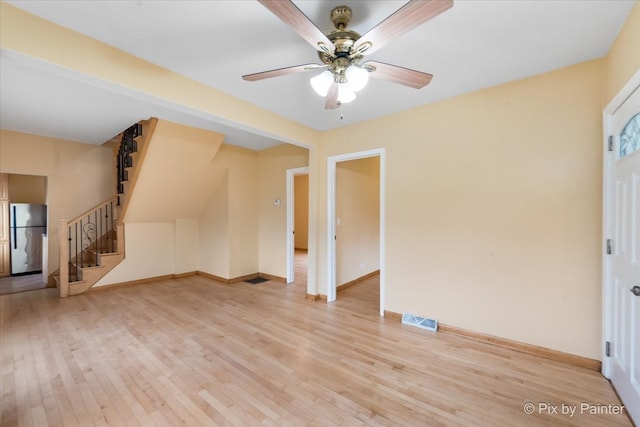 interior space featuring ceiling fan and light wood-type flooring