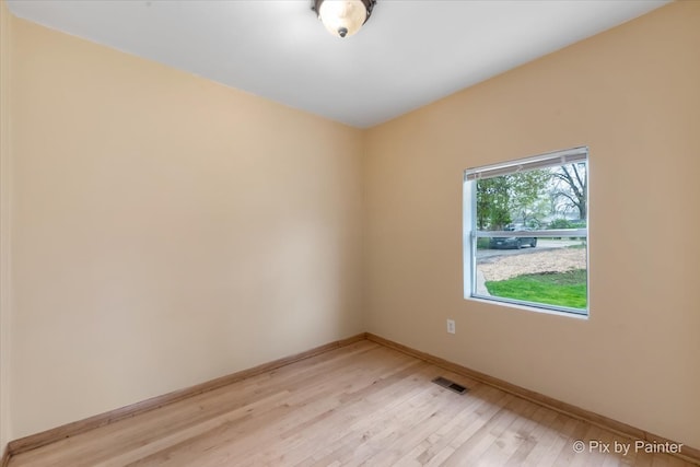 unfurnished room featuring light hardwood / wood-style flooring