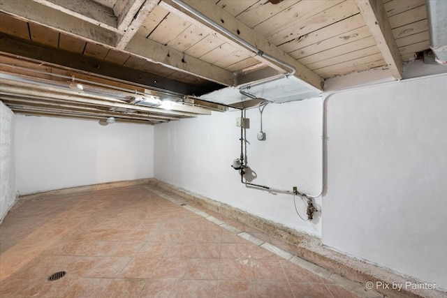 basement with tile patterned floors