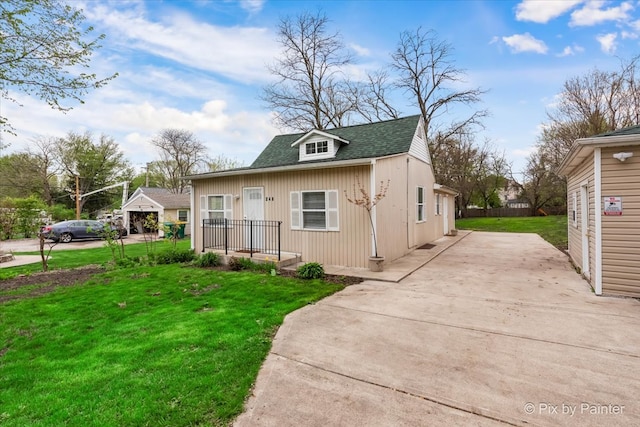 rear view of house with a yard