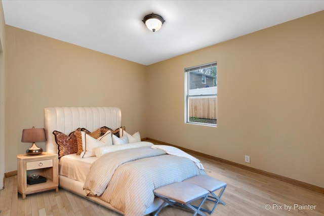 bedroom with light wood-type flooring