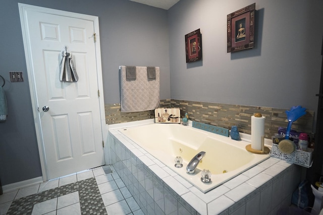 bathroom with tile patterned flooring and tiled tub