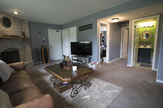 carpeted living room with a textured ceiling and a brick fireplace