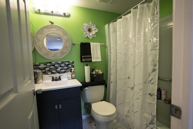 bathroom with curtained shower, tasteful backsplash, tile patterned floors, toilet, and vanity