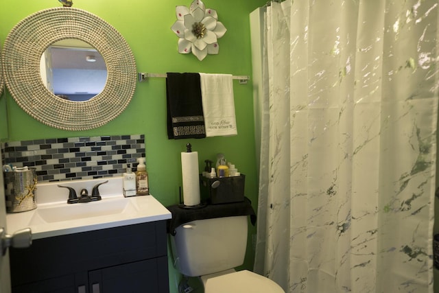 bathroom with decorative backsplash, walk in shower, and vanity