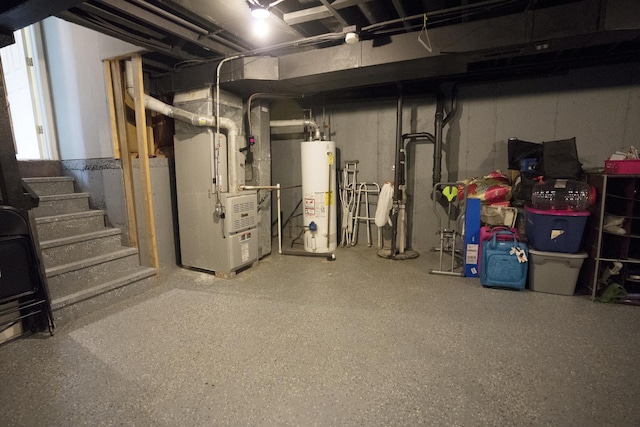 basement with gas water heater and heating unit