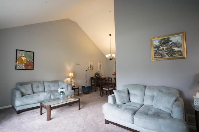 living room featuring carpet flooring, a notable chandelier, and lofted ceiling