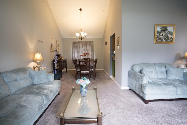 carpeted living room with high vaulted ceiling and an inviting chandelier