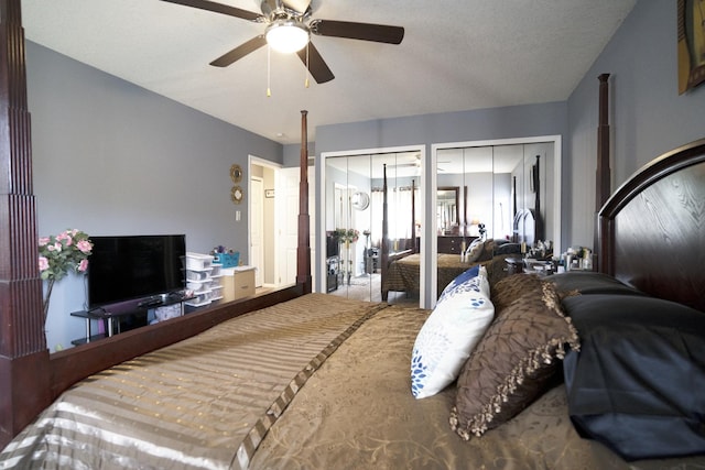 bedroom featuring multiple closets, ceiling fan, and a textured ceiling