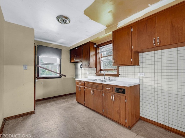 kitchen featuring backsplash and sink