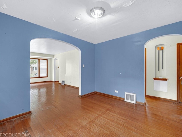 empty room featuring hardwood / wood-style floors