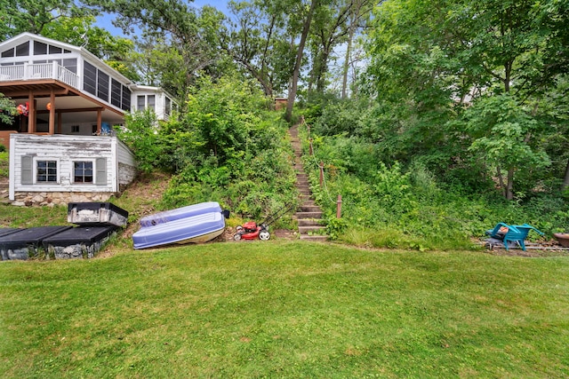 view of yard with a sunroom