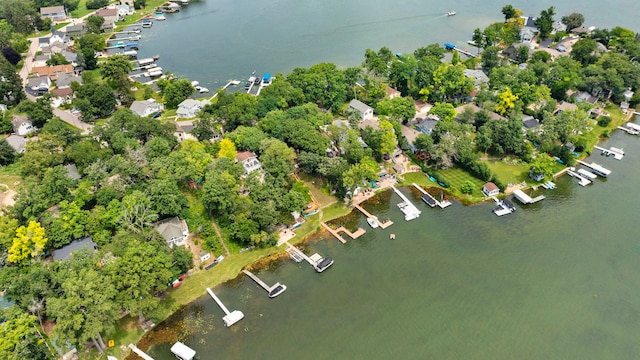 drone / aerial view featuring a water view and a residential view