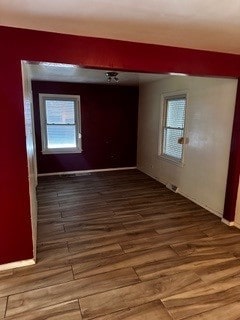 empty room with wood-type flooring