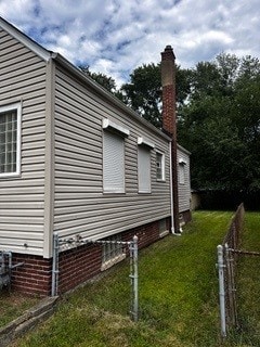 view of home's exterior with a lawn