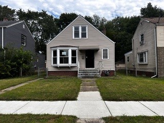 bungalow with a front lawn