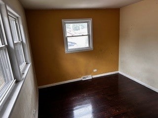 empty room with hardwood / wood-style floors