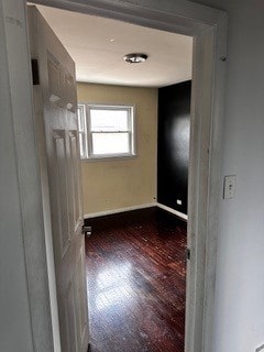 empty room featuring wood-type flooring