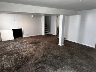 basement with dark colored carpet