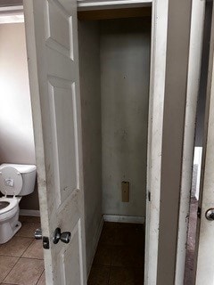 bathroom featuring tile patterned floors and toilet