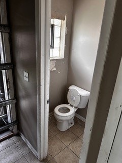 bathroom with tile patterned floors and toilet