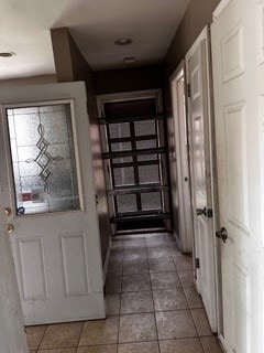 doorway featuring tile patterned floors