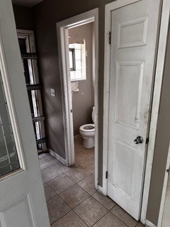 bathroom featuring tile patterned floors and toilet