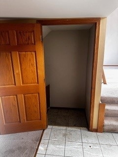 hallway with light tile patterned floors