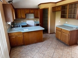 kitchen with light tile patterned flooring and sink