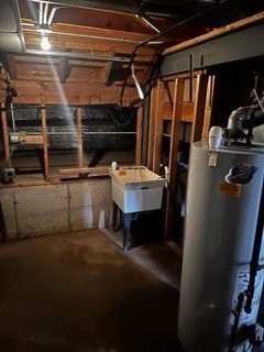 basement with sink and gas water heater