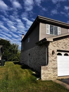 view of side of property featuring a garage