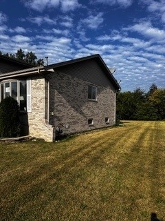 view of property exterior with a lawn