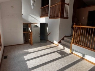 unfurnished living room featuring carpet flooring