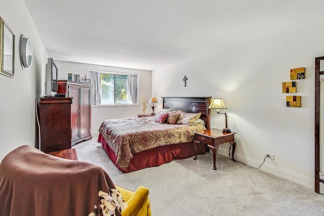 bedroom with light colored carpet