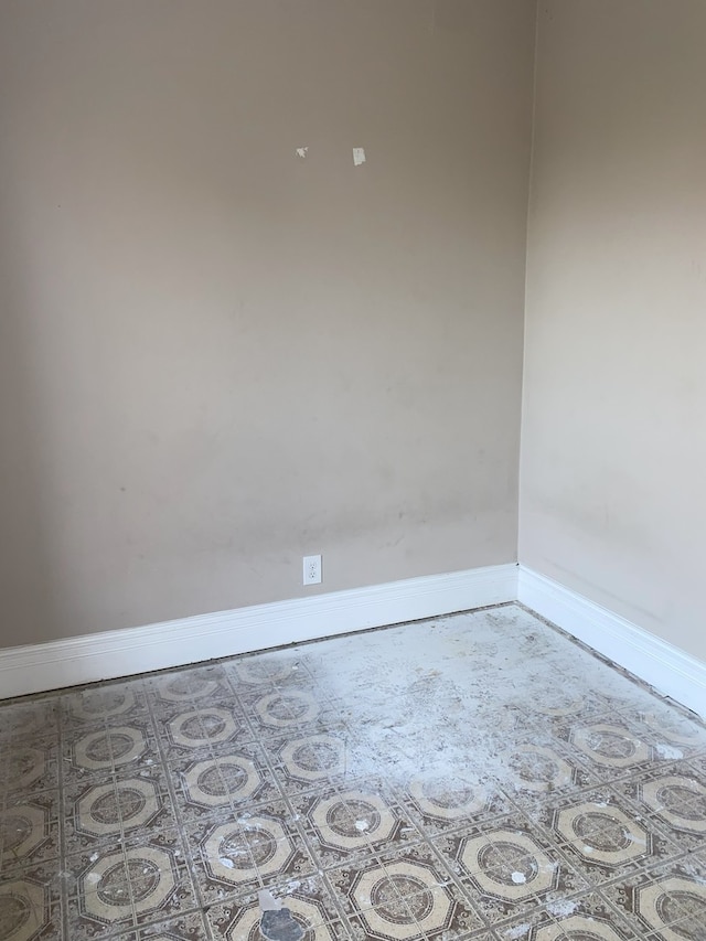 spare room with tile patterned flooring