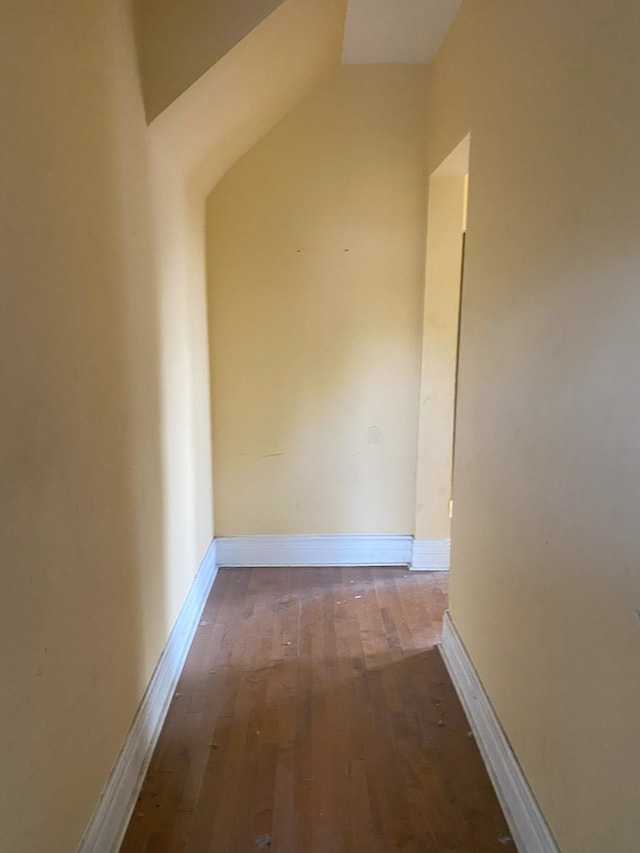 interior space with wood-type flooring and vaulted ceiling