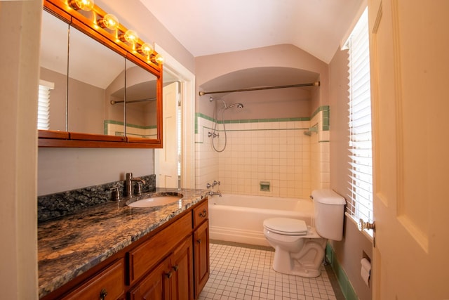 full bathroom featuring tile patterned floors, a healthy amount of sunlight, tiled shower / bath combo, and vaulted ceiling