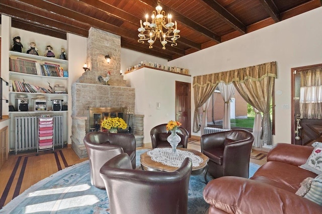 living room featuring a stone fireplace, a notable chandelier, wood finished floors, wood ceiling, and beam ceiling