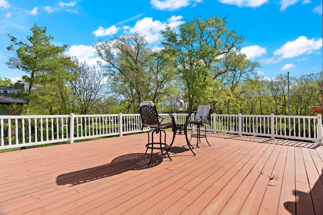 deck with outdoor dining area